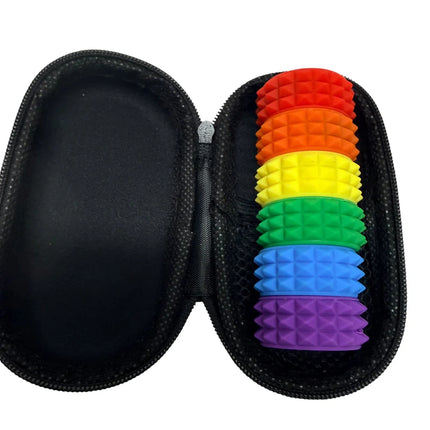 MagStak Core - Textured rainbow-colored textured silicone rings in a black zippered carrying case for sensory use