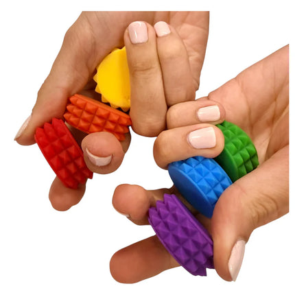 Hands holding colorful textured rings in red, orange, yellow, green, blue, and purple, MagStak Core - Textured