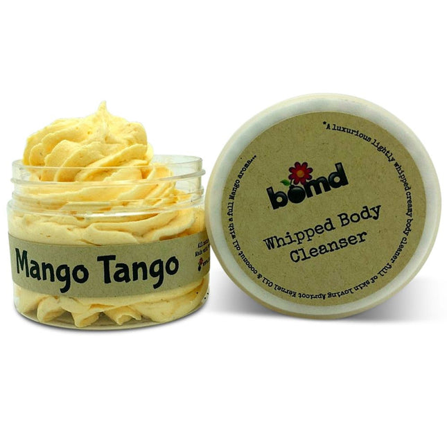 Mango Mango Whipped Body Cleanser in a jar with creamy yellow texture, promoting calm, connection, and support.