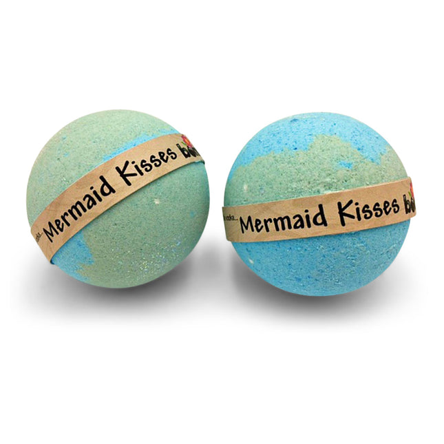 Two pastel blue and green bath bombs wrapped with a label reading Mermaid Kisses Coconut Lime Bubble Bath Bomb Set of 6