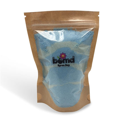 Mermaid Kisses Fizzing Bubble Bath in resealable bag with natural blue powder, helping families thrive with tools to calm, connect and support.