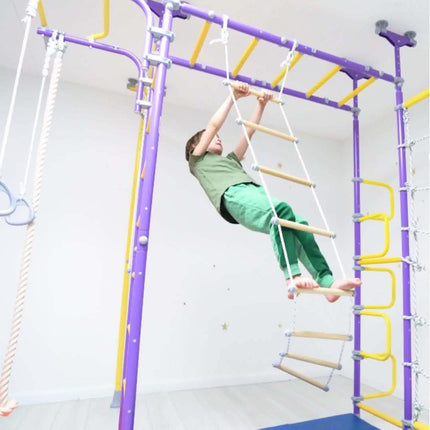 Child climbing wooden ladder attached to purple and yellow frame of Ninja Home Play Set - No Drill indoor equipment