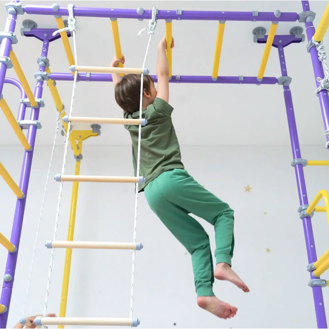 Child climbing indoor play gym ladder with purple and yellow bars Ninja Home Play Set - No Drill