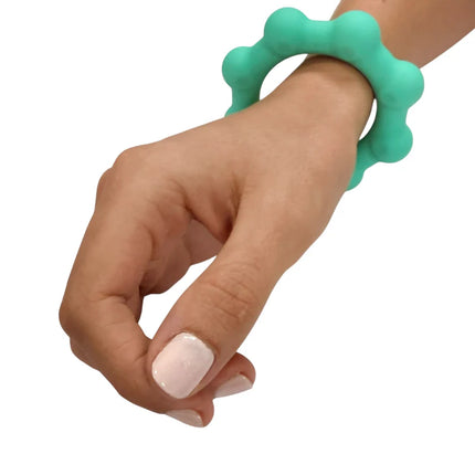 Octopop - Quiet. Wearable. Satisfying teal sensory fidget bracelet worn on wrist for calmness and focus