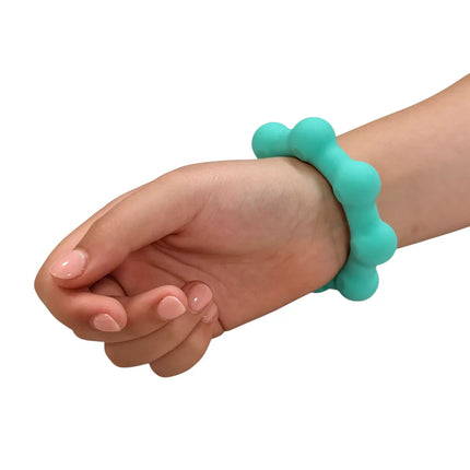 Octopop - Quiet. Wearable. Satisfying teal sensory fidget bracelet on wrist designed for calming and focus.
