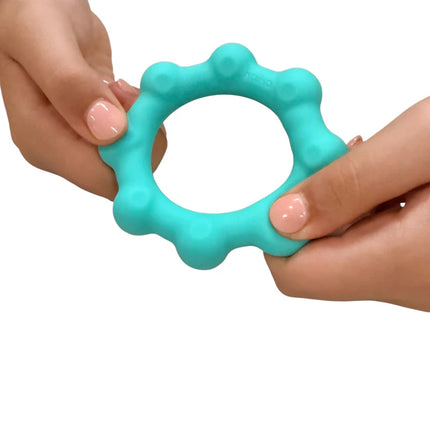 Hands holding a blue textured fidget ring, Octopop - Quiet. Wearable. Satisfying sensory toy in use