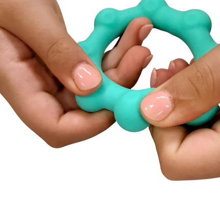 Hands holding and squeezing a turquoise sensory fidget toy with rounded bumps, Octopop - Quiet. Wearable. Satisfying