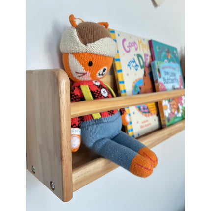 JORY W1 — Front-Facing Wall Bookshelf holding children’s books and a colorful stuffed fox toy helping families thrive with tools to calm, connect and support