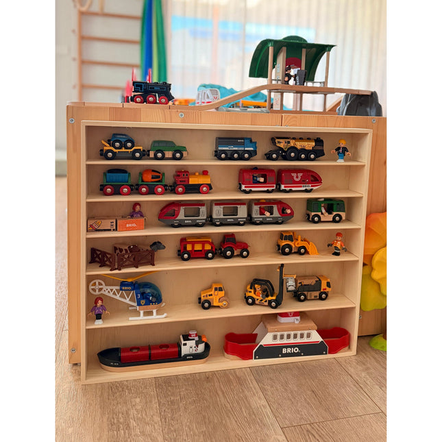 JTRAIN Train Display Rack wooden shelf holding toy vehicles, trains, and small action figures in a bright room