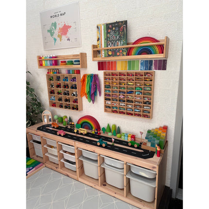 JCAR 60 —Diecast Display Rack showcasing organized toy cars in a vibrant sensory-friendly playroom setup.