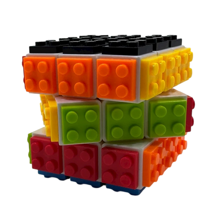 Bright multicolored interlocking pieces forming a cube toy named Brick Style Cube for sensory and educational use.
