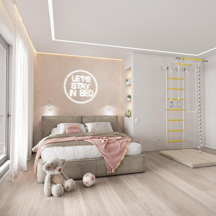 Bright modern bedroom featuring Sensory Swedish Wall Bars with rings and rope beside a cozy bed and toys on the floor.