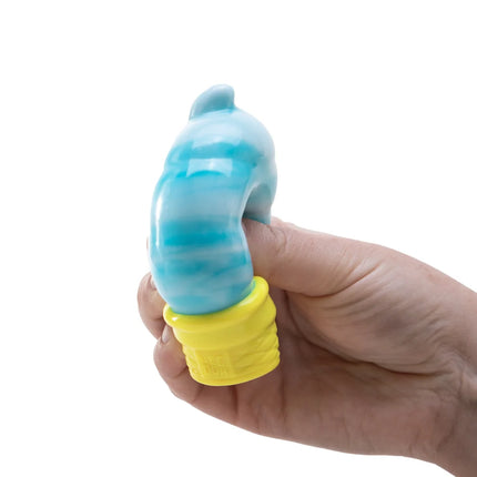 Hand holding a blue and yellow fidget toy against a white background