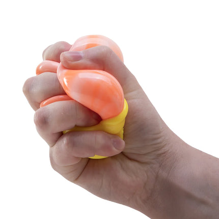 Hand squeezing an orange and yellow sensory squishy object