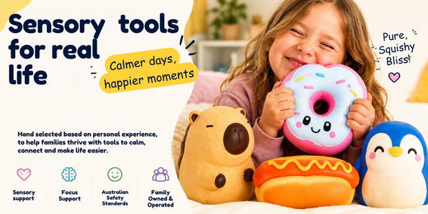 Child holding a pink donut squishy beside plush bear hot dog and penguin on a sensory tools banner