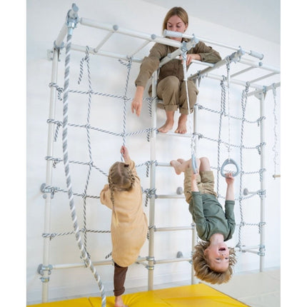 Woman supervising two children playing on a Sensory Climbing Monkey Bars Ladder with rope nets and grips indoors