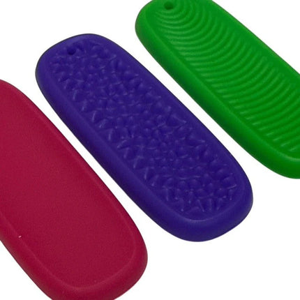 Tac Tiles sensory fidget set with red, purple, and green textured tiles for tactile stimulation and focus.