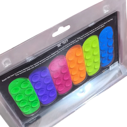 Tac Tiles colorful sensory fidget tiles designed for tactile play and sensory input, contained in clear packaging