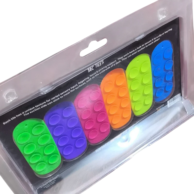 Tac Tiles colorful sensory fidget tiles designed for tactile play and sensory input, contained in clear packaging