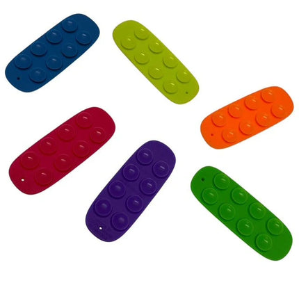 Tac Tiles colorful sensory fidget pieces with raised dots for tactile play and stress relief benefits.