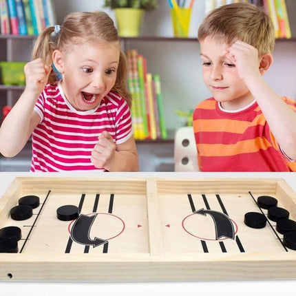 Two children play with Hockey Table Game, Wooden Fast Sling Puck Game, Super Football Table Compatible with Sports Games, helping families thrive.