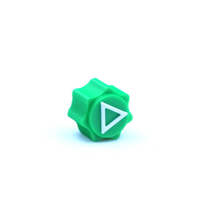 Green plastic piece with white triangle symbol from Squid Game 2 Gonggi & Case Korean Grab 5 stone sieves+rectangular box helping families thrive with tools to calm, connect and support