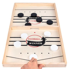 Fast Sling Puck Game, Wooden Hockey Game, Super Soccer Table with hand launching puck for family fun and connection.