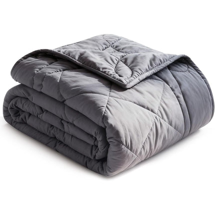 Folded gray weighted blanket on a white background