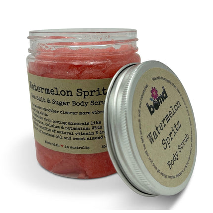 Watermelon Spritz Body Scrub Sea Salt Sugar & Coconut Oil with Vitamin E in clear jar with silver lid, skincare product
