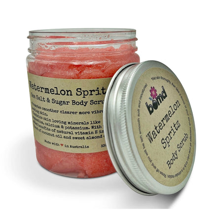 Watermelon Spritz Body Scrub Sea Salt Sugar & Coconut Oil with Vitamin E in clear jar with beige label and silver lid.