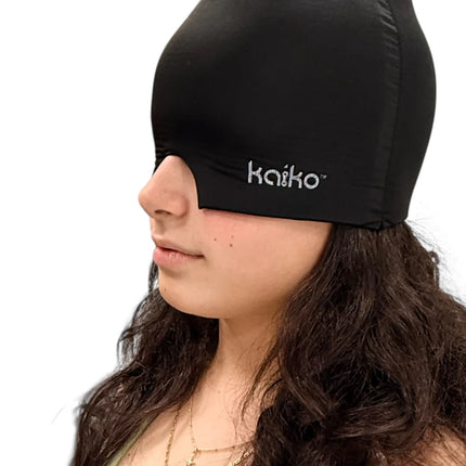 Person wearing the Block Out Cooling Head Mask – a cool ‘hug’ for your head in black for sensory relief and comfort