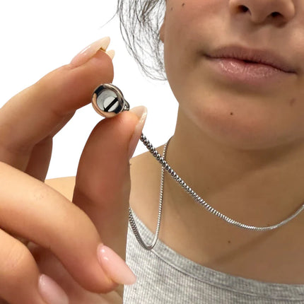 Breath Tool 304 grade Stainless Steel IN WINDOW TIN - Mindful Breathing Unisex Necklace held close to lips for calming use
