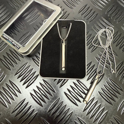 Breath Tool 304 grade Stainless Steel IN WINDOW TIN - Mindful Breathing Unisex Necklace displayed with packaging on textured surface