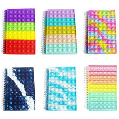 Six colorful Fidget Toys Popper Notebook A5 100 pages with sensory bubble popper covers in various pastel and bright designs.