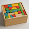 Eco Wooden Building Blocks 50pcs – Montessori Toy in a wooden tray with colorful geometric shapes, helping families thrive.