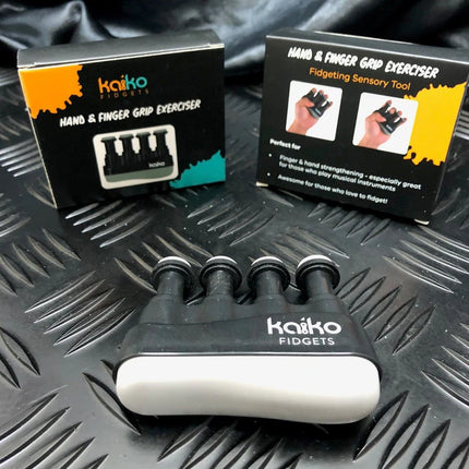 Hand & Finger Grip Exerciser & Fidgeting Sensory Tool in black with four finger grips, designed for strengthening and sensory engagement.
