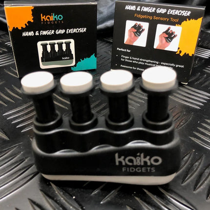 Compact black Hand & Finger Grip Exerciser & Fidgeting Sensory Tool with white tops, designed for finger strengthening and therapy.