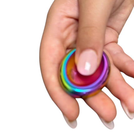 Hand holding a colorful metallic fidget spinner with smooth rounded edges, Groove Stone - Dual Support Necklace & Key Chain