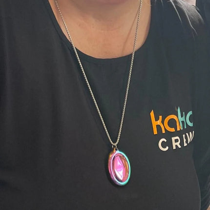 Person wearing the Groove Stone - Dual Support Necklace & Key Chain with colorful iridescent pendant on silver chain