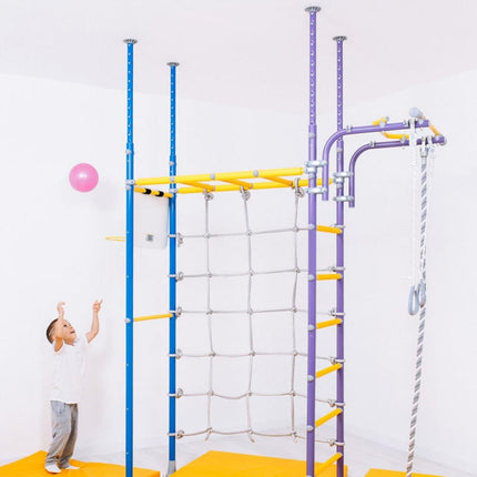 Child playing near Swedish Home Play gym set - No Drill with colorful climbing bars and rope ladder indoors
