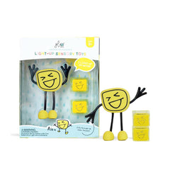 Glo Pal Character yellow light-up sensory toy with smiling face, flexible arms and legs, and two small cubes.