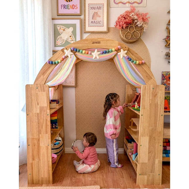 Library & Play Station — JoyNOOK wooden play nook with rainbow canopy and two children playing