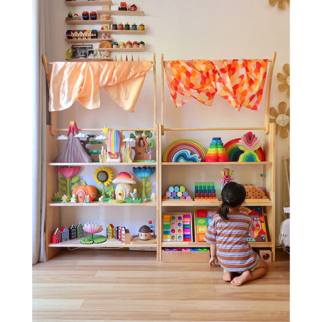 Library & Play Station — JoyNOOK with colorful shelves of sensory toys and educational games for children