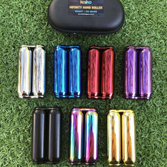 Metallic infinity hand rollers in assorted colours with a black case on artificial grass