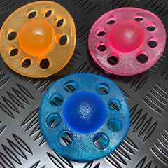 Three colorful sensory fidgets in pink, blue, and orange for Out of This World Grip - Emotional Regulation and Strengthening tool.