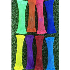 Colorful mesh sensory fidget toys arranged on grass