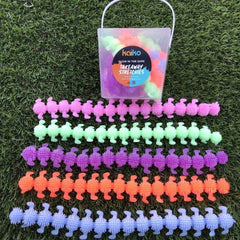 Colorful textured sensory stretch toys arranged in pink, green, purple, orange and blue rows with a clear carry bag