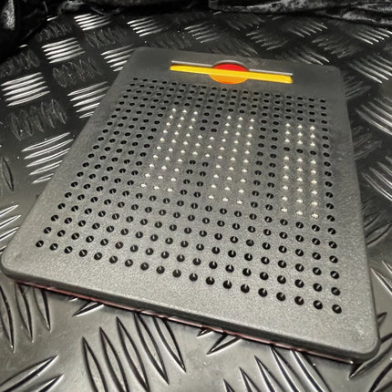 Black magnetic board with raised dots forming the word “CAN” in white, featuring a red and yellow slider on top, Magnetic Pad - Original Rectangle Design.