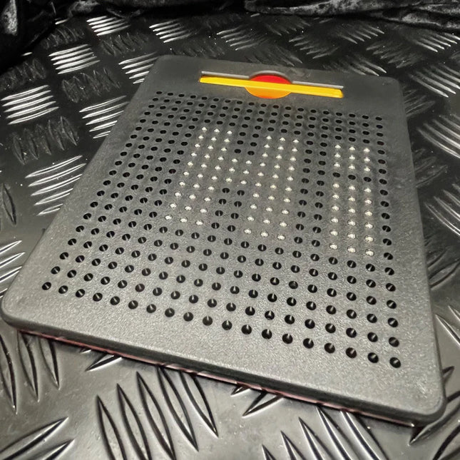 Black magnetic board with raised dots forming the word “CAN” in white, featuring a red and yellow slider on top, Magnetic Pad - Original Rectangle Design.