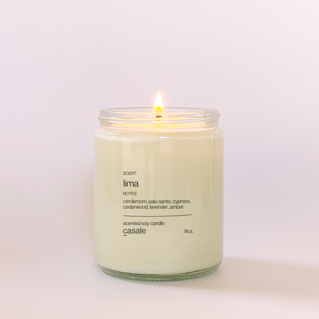 LIMA SINGLE WICKED SOY CANDLE (8oz / 226g) lit with calming scent notes, helping families thrive with tools to calm, connect and support.